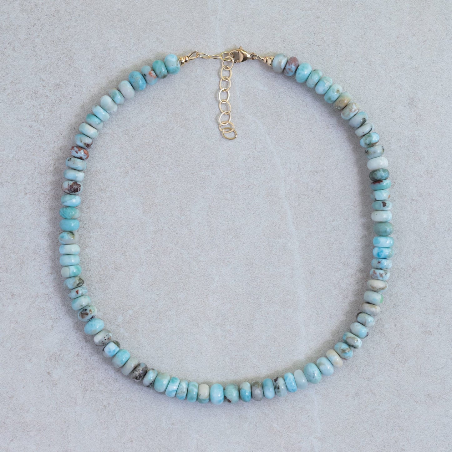 Candy Larimar necklace by Earthly Abundance featuring a smooth, oval Larimar pendant on a delicate silver chain.