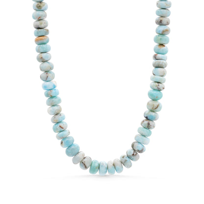 Elegant Candy Larimar necklace by Earthly Abundance featuring a polished blue larimar pendant on a silver chain.
