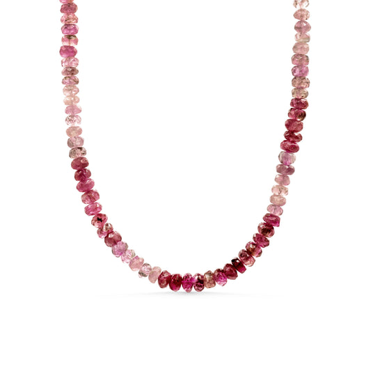 Pink tourmaline necklace from Earthly Abundance featuring a delicate string of vibrant pink gemstones.