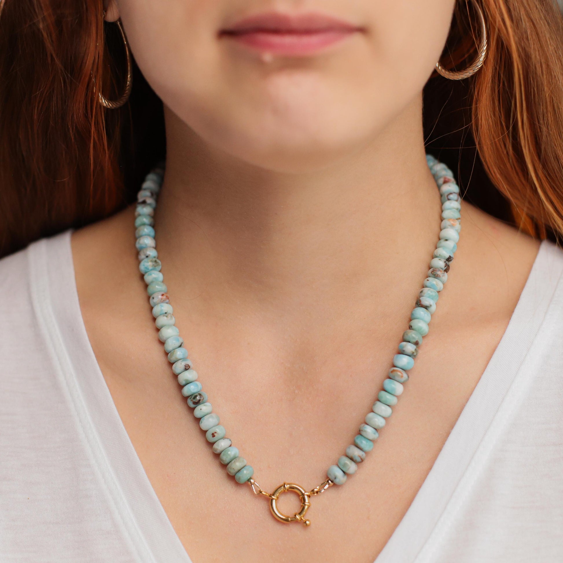 Larimar toggle necklace by Earthly Abundance featuring a blue gemstone pendant on a silver chain.