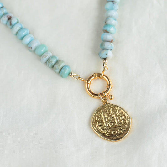 Larimar toggle necklace by Earthly Abundance featuring a polished blue gemstone pendant on a silver chain.