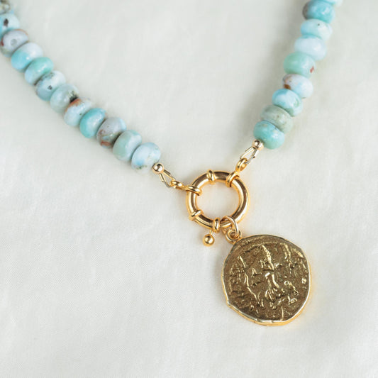 Larimar toggle necklace featuring a blue stone pendant on a silver chain, crafted by Earthly Abundance.