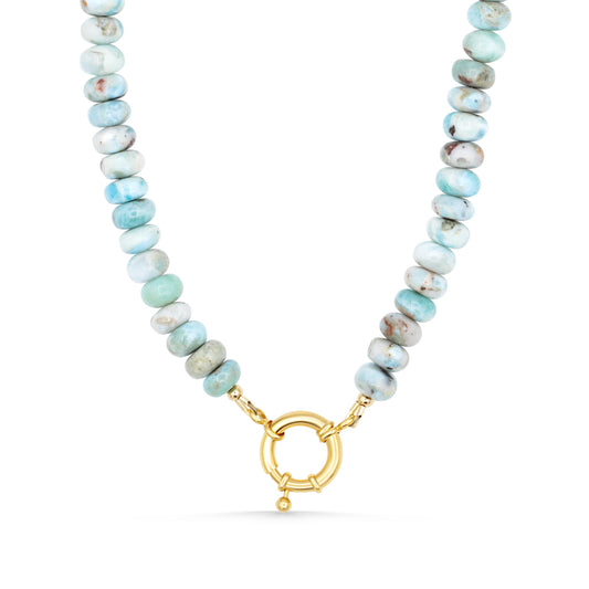 Larimar toggle necklace by Earthly Abundance featuring a blue gemstone pendant on a silver chain.