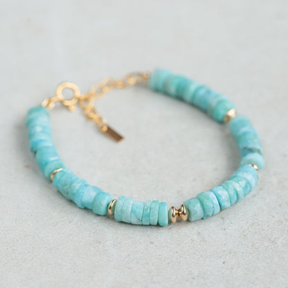 Larimar Heishi bracelet with 14K gold-filled beads, featuring smooth blue stone discs on a delicate gold-filled chain.