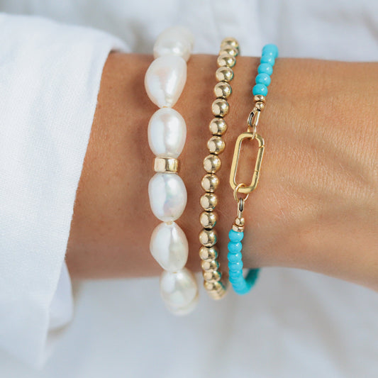 14K Sleeping Beauty Carabiner Bracelet by Earthly Abundance featuring a detailed Sleeping Beauty turquoise stone and silver hardware.