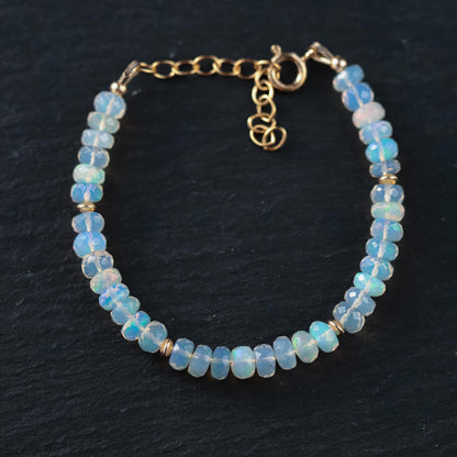 Ethiopian Welo Opal dainty bracelet featuring 14K gold chain and vibrant opal stones, stylish and elegant jewelry piece.