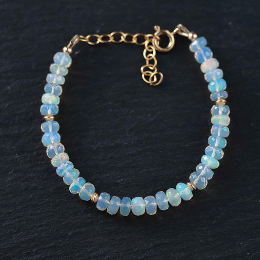 Ethiopian Welo Opal dainty bracelet with 14K gold chain, featuring vibrant opal gemstones and delicate design.