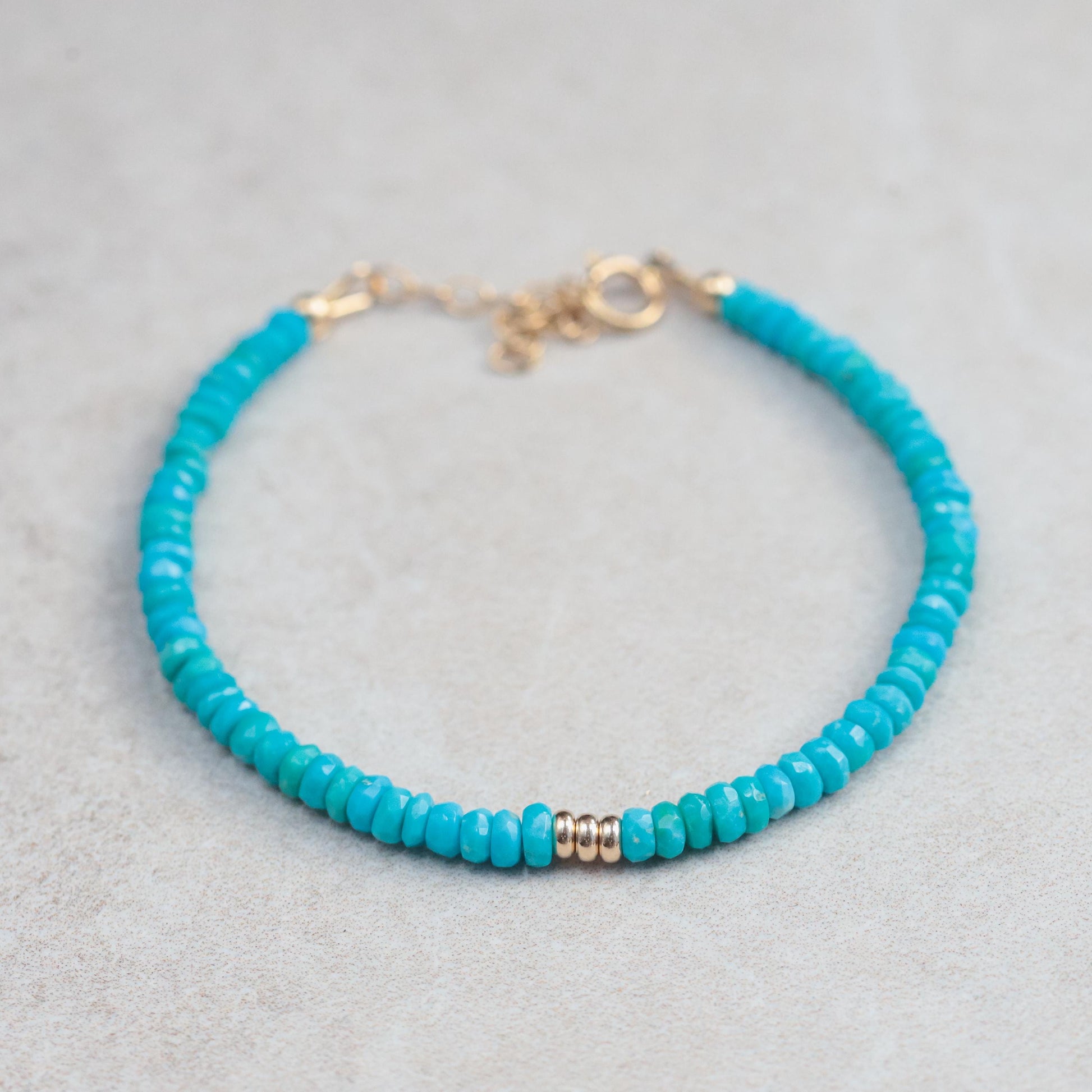 Sleeping Beauty turquoise bracelet in 14K gold with round turquoise stones, elegant jewelry piece by Earthly Abundance.
