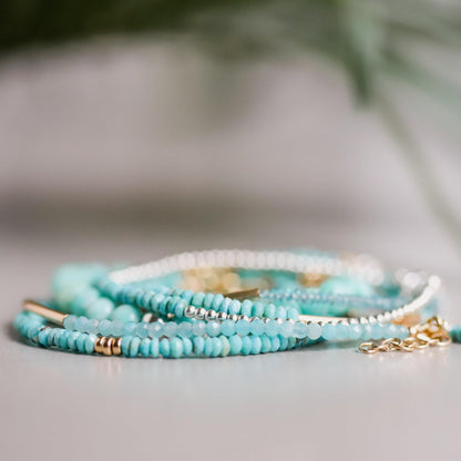 Sleeping Beauty turquoise bracelet with 14K gold setting, featuring vibrant blue turquoise stones, by Earthly Abundance.