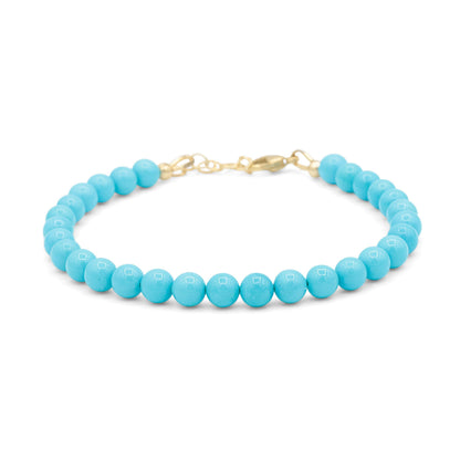 Adjustable Sleeping Beauty turquoise ring in 14K gold from Earthly Abundance, featuring a vibrant blue turquoise gemstone.