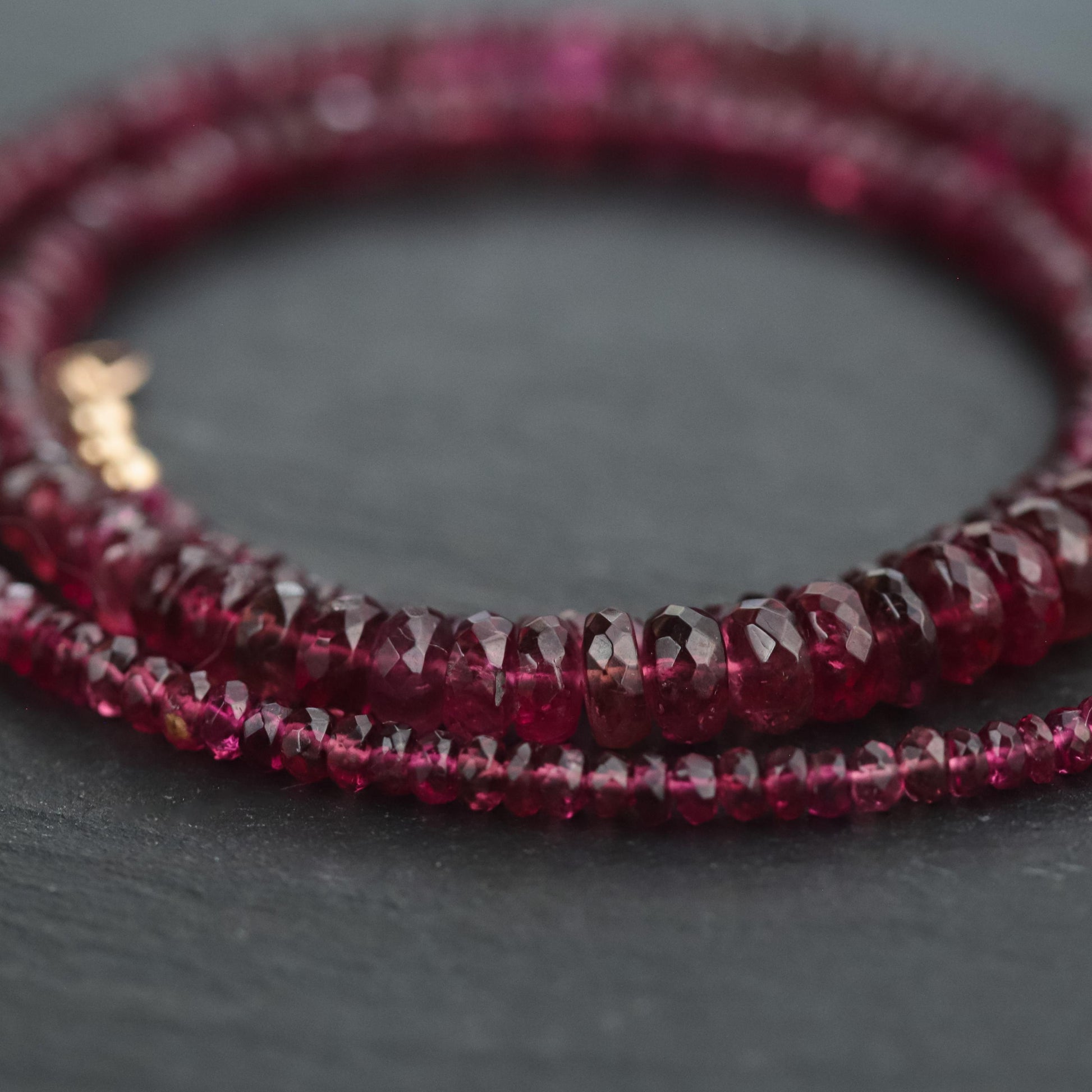 Rosé Ember Pink Tourmaline necklace in 14K gold with a delicate pendant, showcasing a vibrant pink gemstone on a fine chain.