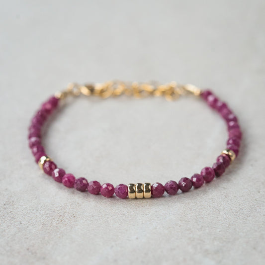 Elegant Wild Berry Ruby bracelet in 14K gold from Earthly Abundance featuring vibrant ruby stones and delicate gold links.