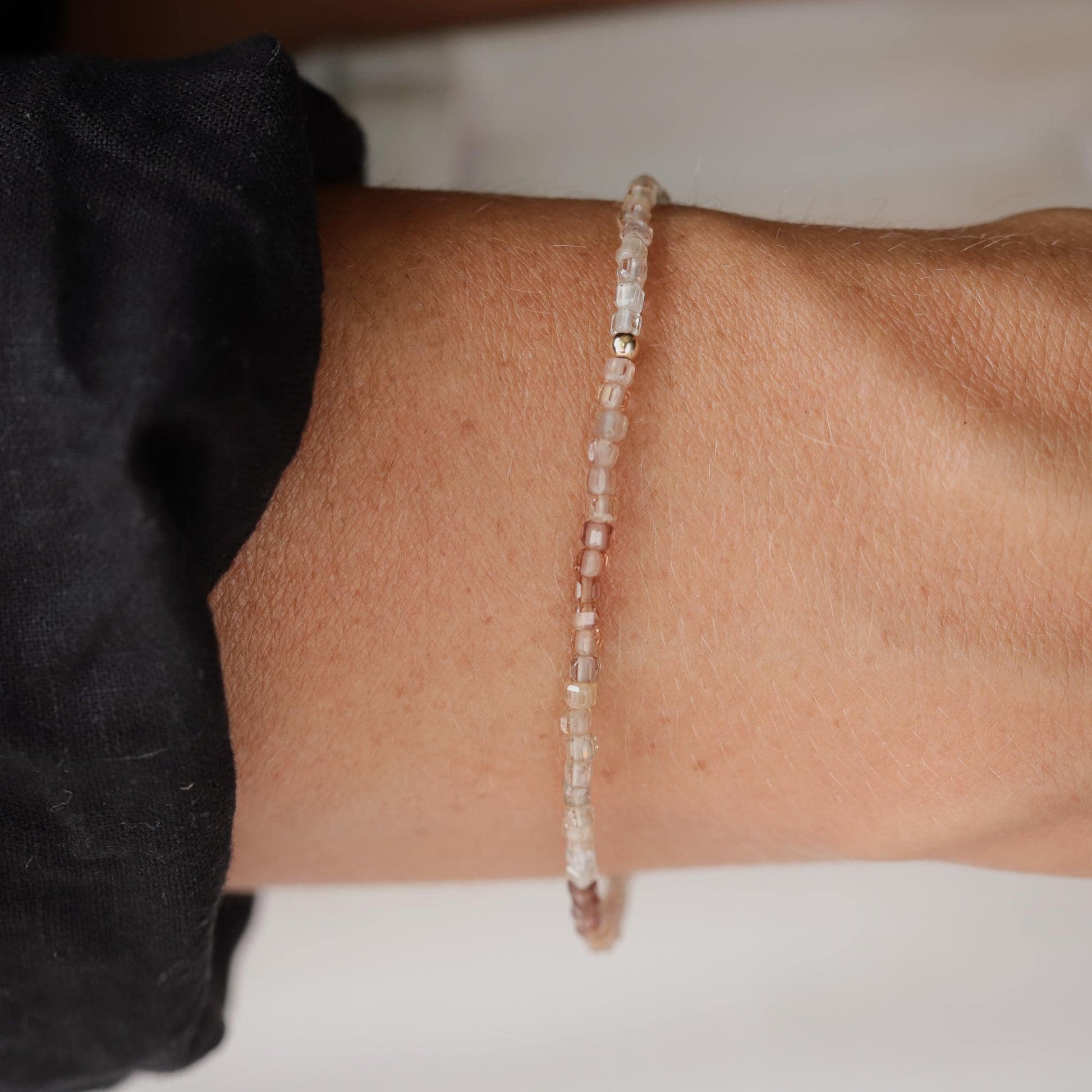Earthly Abundance Zircon Cube Stretch Bracelet with 14K gold accents, showcasing sparkling cubic zirconia stones on a flexible band.