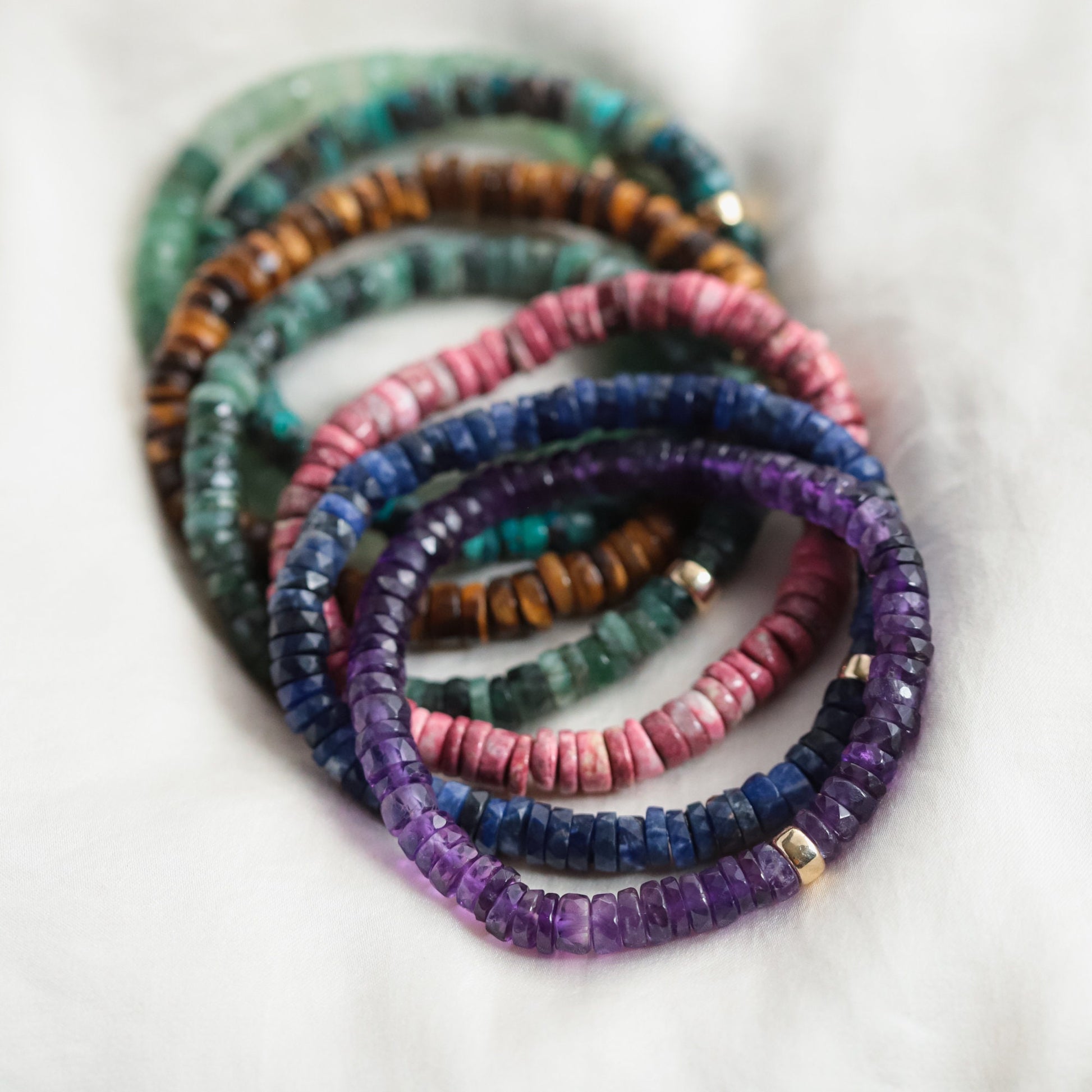 Earthly Abundance Amethyst Heishi bracelet featuring small purple gemstone beads on a stretch elastic band.