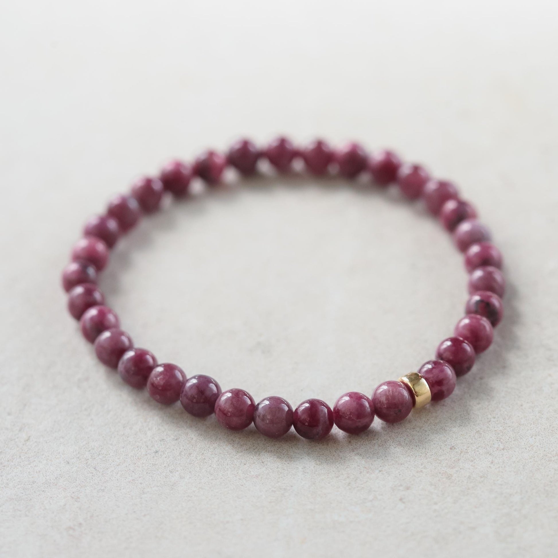 Elegant 5mm ruby bracelet in 14K gold featuring vibrant red rubies, crafted by Earthly Abundance.