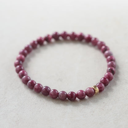 Elegant 5mm ruby bracelet in 14K gold featuring vibrant red rubies, crafted by Earthly Abundance.