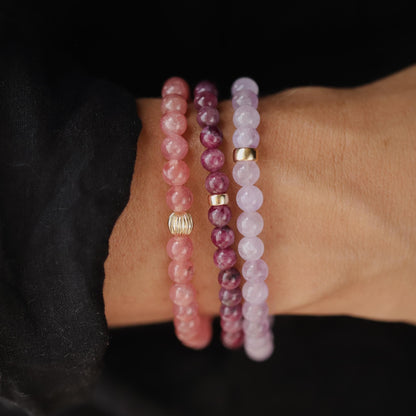 Elegant 5mm ruby bracelet crafted with 14K gold by Earthly Abundance, featuring vibrant red rubies in a sleek design.