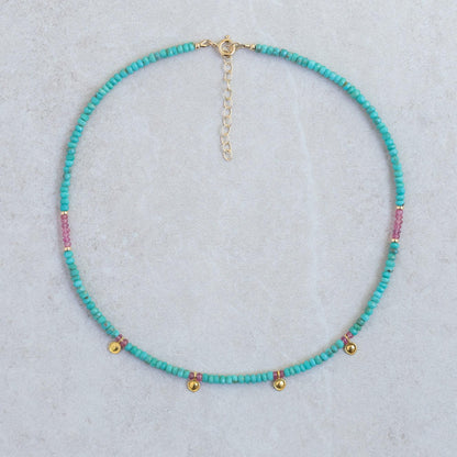 Turquoise and pink sapphire necklace with silver chain, featuring vibrant gemstones and elegant design by Earthly Abundance.