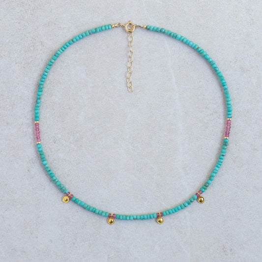 Turquoise and pink sapphire necklace with silver chain, featuring vibrant gemstones and elegant design by Earthly Abundance.