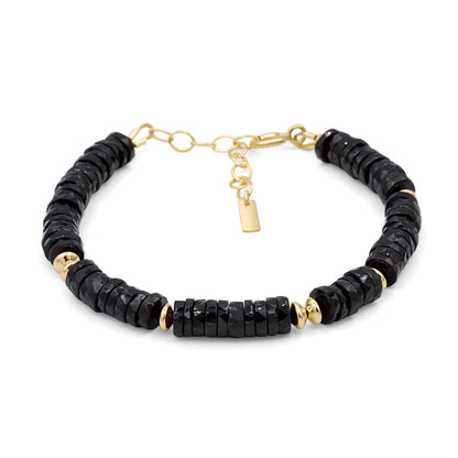 Black Tourmaline Heishi bracelet by Earthly Abundance featuring small, round black gemstone beads on a stretchy band.