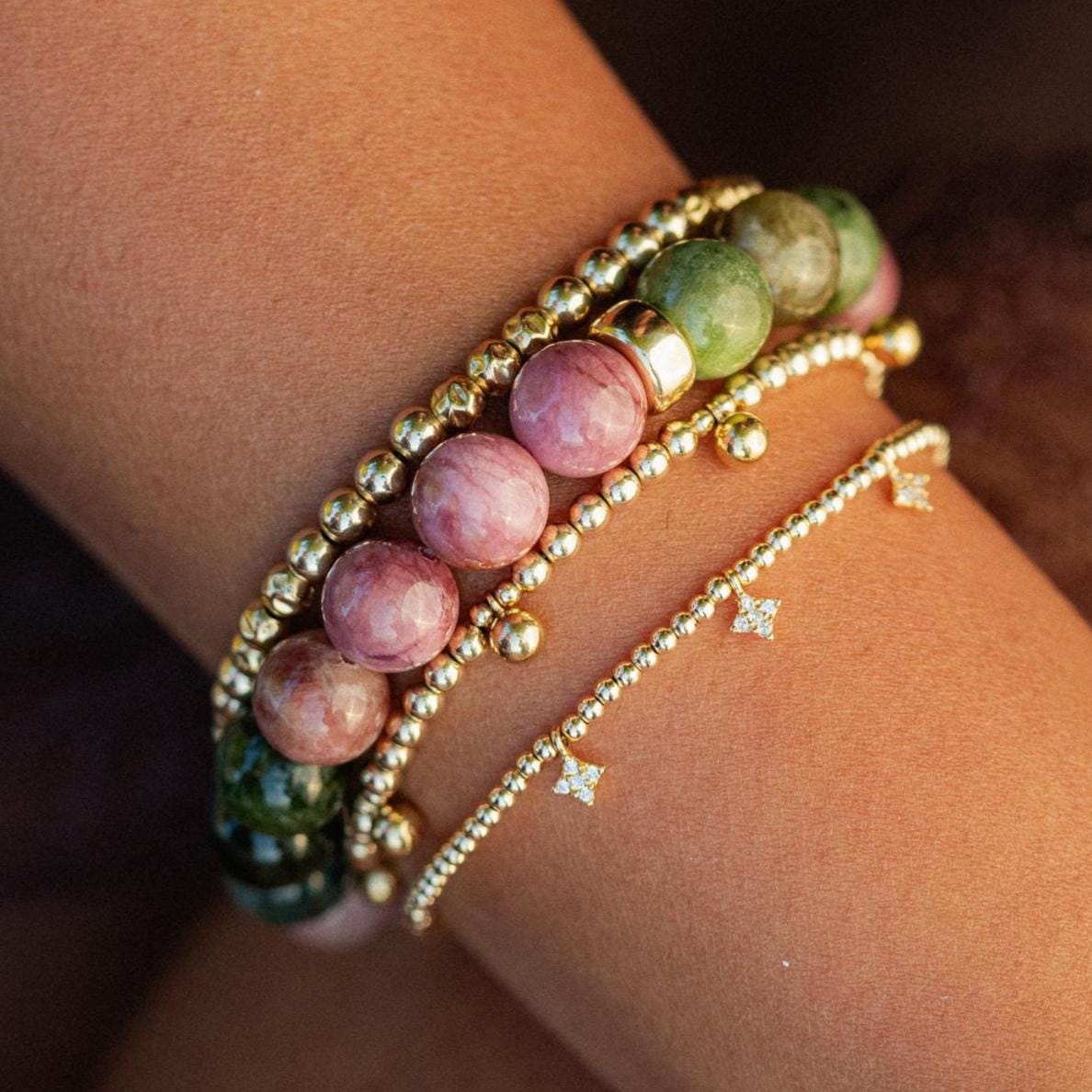 Mixed tourmaline strength bracelet with 14K gold setting, featuring colorful tourmaline stones on a delicate gold chain.