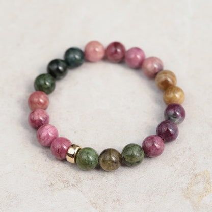 Mixed tourmaline strength bracelet with 14K gold setting, featuring colorful tourmaline gemstones and a delicate clasp.