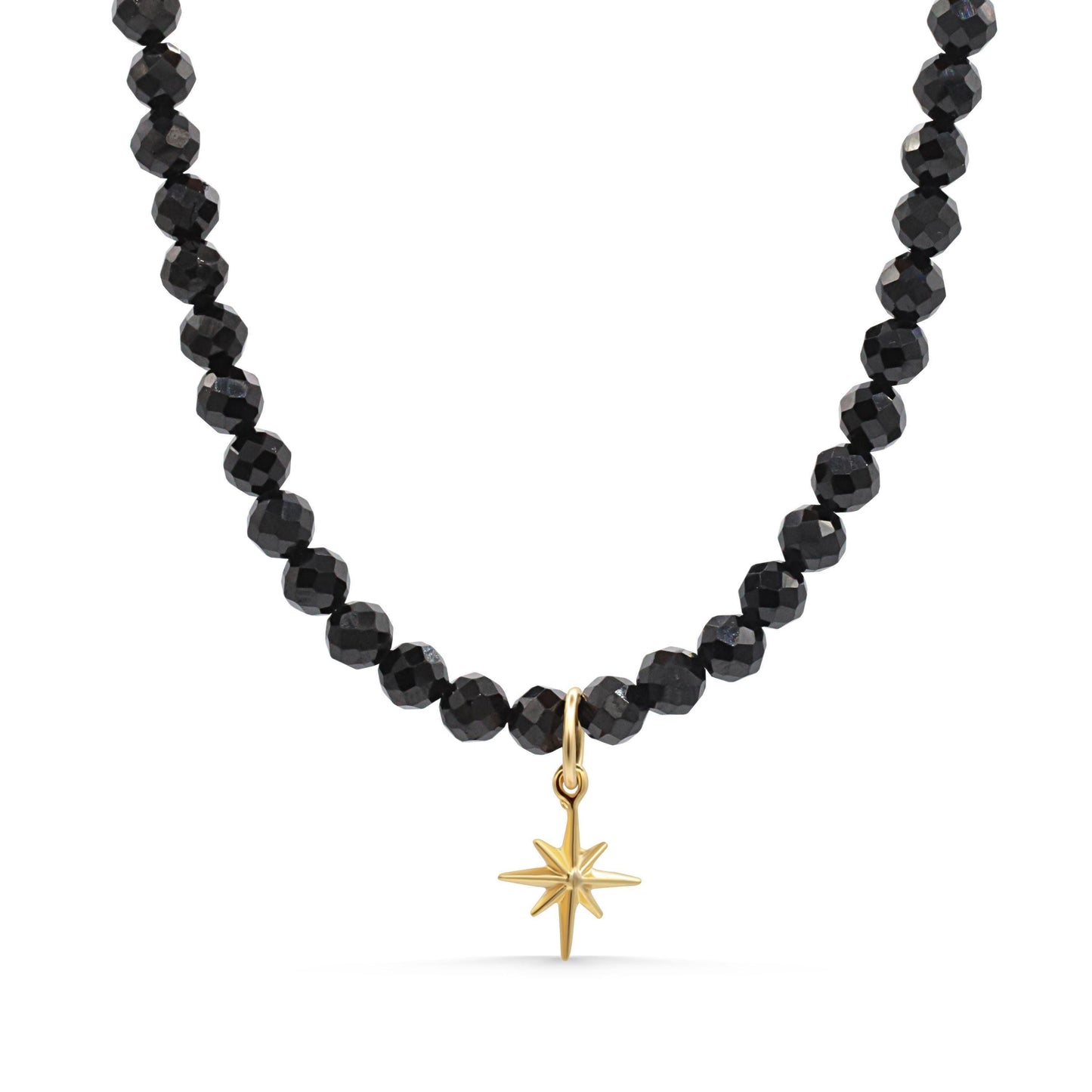 Black Spinel North Star necklace with a silver chain and star-shaped pendant, featuring a polished black spinel stone.