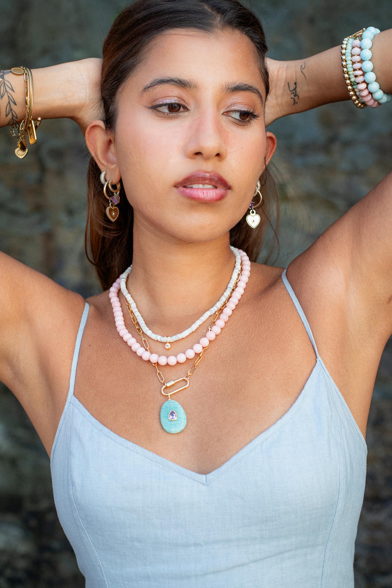 Gold filled paperclip carabiner necklace by Earthly Abundance, showcasing a sleek, shiny gold chain with a secure clasp.