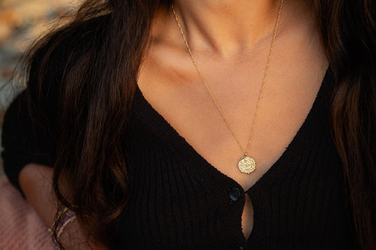 Greek style pendant necklace by Earthly Abundance featuring a detailed pendant on a delicate chain.