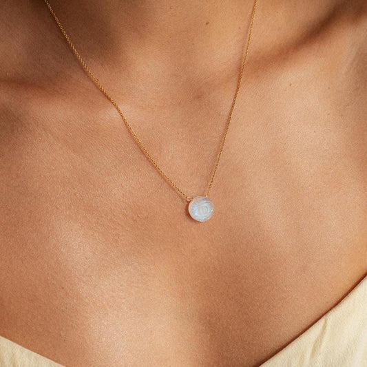 Evil Eye Moonstone pendant necklace by Earthly Abundance showcasing a glowing moonstone with protective evil eye charm.