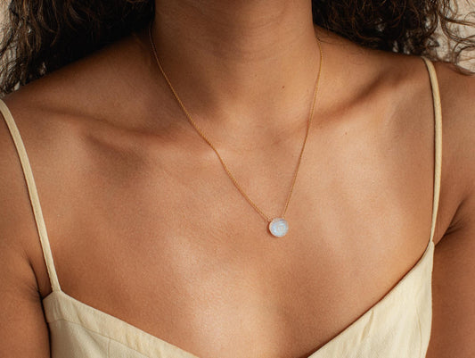 Evil Eye Moonstone Pendant Necklace by Earthly Abundance featuring a shimmering moonstone and protective evil eye charm.