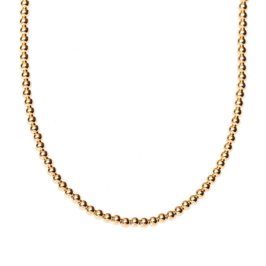 14k gold filled necklace from Earthly Abundance Jewelry, close-up view showcasing delicate chain and elegant design.