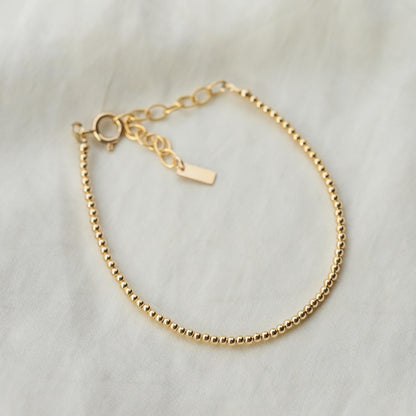 Adjustable gold-filled beaded ball bracelet with fine beading and a secure clasp, crafted by Earthly Abundance.