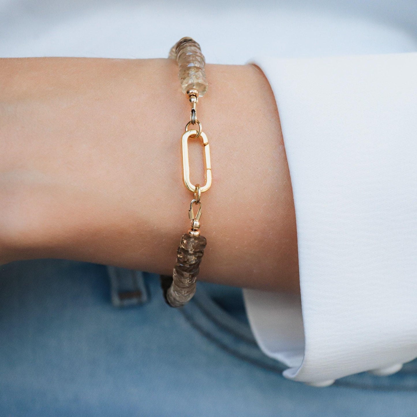 Faceted smoky quartz bracelet by Earthly Abundance featuring polished, faceted beads on a delicate stretch cord.