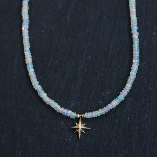 Ethiopian Opal North Star Necklace in 14K gold from Earthly Abundance featuring a sparkling star-shaped opal pendant.