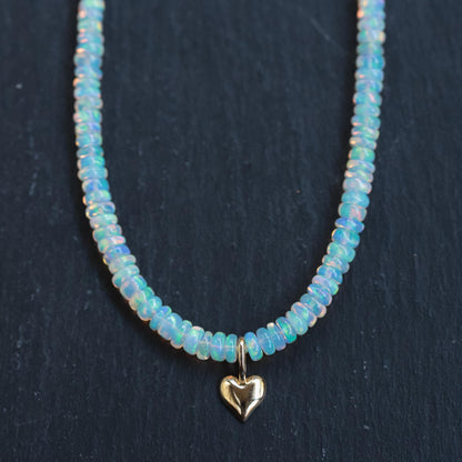 Ethiopian Opal heart necklace with 14K gold chain, featuring a vibrant, polished heart-shaped opal pendant.