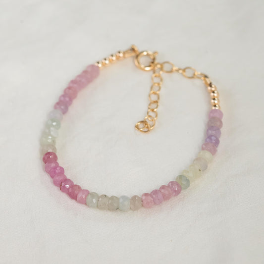 Multi sapphire bracelet by Earthly Abundance featuring vibrant blue and purple sapphires set in a delicate silver bracelet.