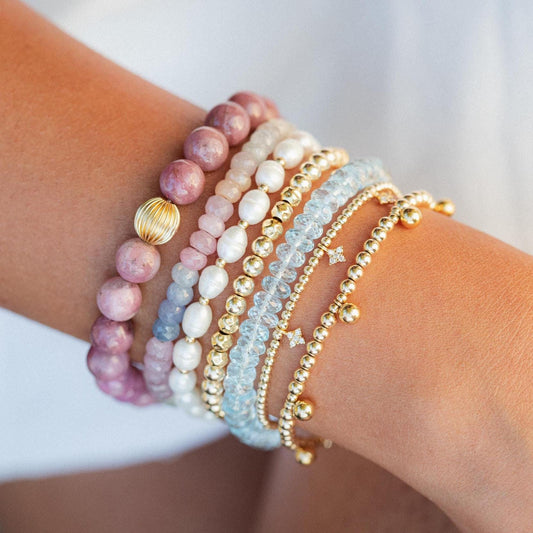 Multi sapphire bracelet by Earthly Abundance featuring vibrant blue and green sapphires on a delicate silver chain.