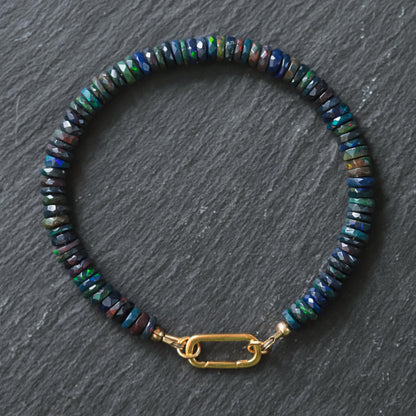 Black Opal Carabiner Bracelet by Earthly Abundance featuring black opal beads and a sturdy metal carabiner clasp.