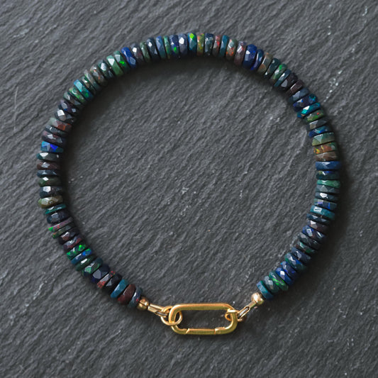 Black Opal Carabiner Bracelet by Earthly Abundance featuring a polished black opal gemstone and a sturdy metal carabiner clasp.