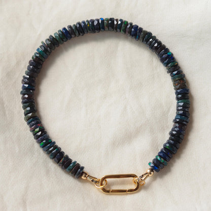 Black Opal Carabiner bracelet by Earthly Abundance featuring a sleek black opal stone on a sturdy carabiner-style clasp.