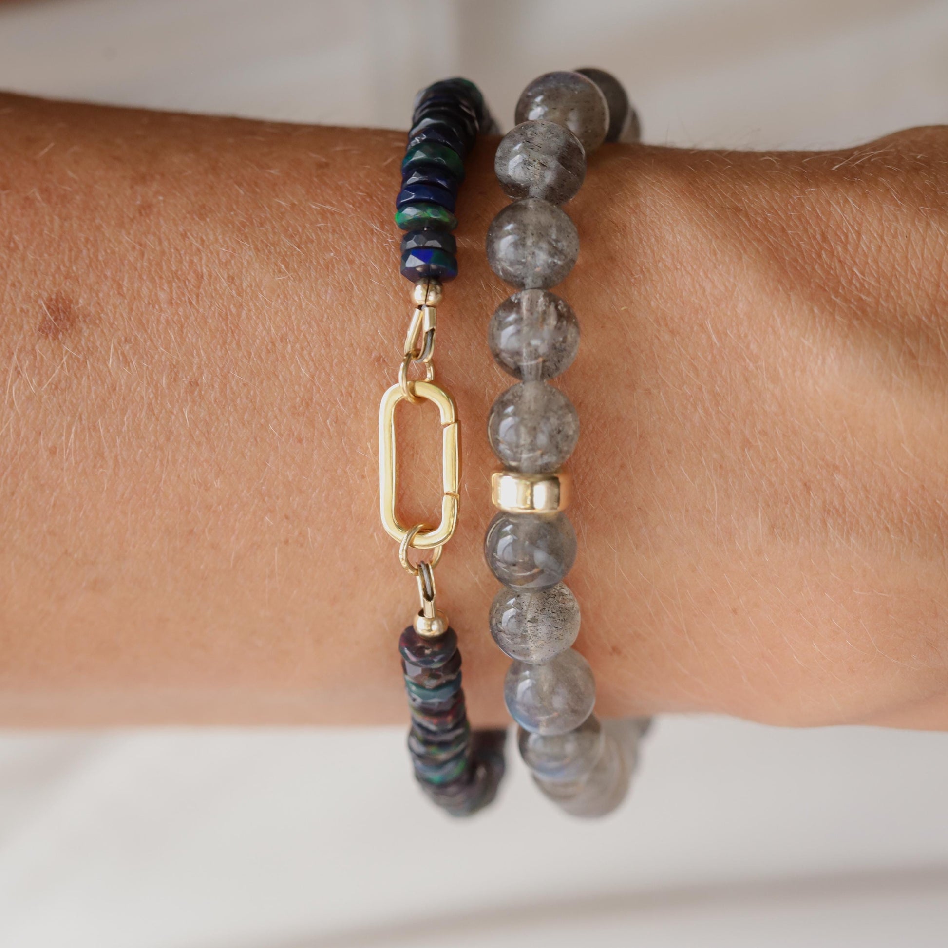 Black Opal Carabiner Bracelet by Earthly Abundance featuring black opal stones on a sturdy metal carabiner clasp.