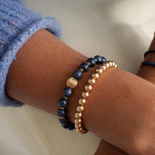 Blue sapphire bracelet in 14K gold with sparkling stones, featuring a delicate chain and elegant design by Earthly Abundance.