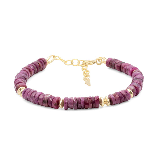 Earthly Abundance Ruby Rhythm Bracelet featuring vibrant red ruby beads and a delicate silver clasp on a neutral background.