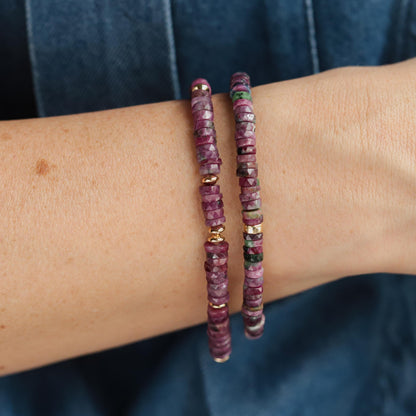 Earthly Abundance Ruby Rhythm Bracelet featuring vibrant red ruby beads and a silver clasp on a neutral background