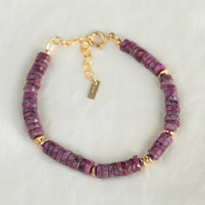 Earthly Abundance Ruby Rhythm Bracelet featuring vibrant red rubies and silver accents on a delicate chain.