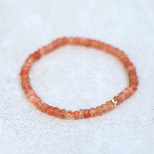 Sunstone bracelet made with 14K gold, featuring polished sunstone beads, by Earthly Abundance.