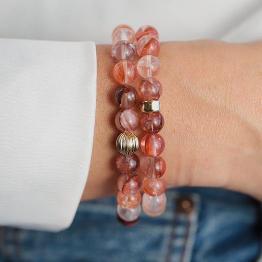 Hematoid quartz crystal set in 14K gold, showcasing the striking reddish-brown mineral with golden accents, from Earthly Abundance.