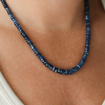 Kyanite necklace with polished blue stones on a silver chain, showcasing natural gemstone details from Earthly Abundance.