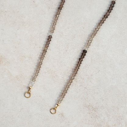 Smoky quartz triangle pendant necklace in 14K gold, featuring a natural gemstone on a delicate chain.